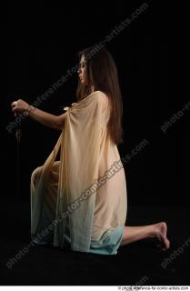 BARBORA KNEELING POSES WITH SWORD